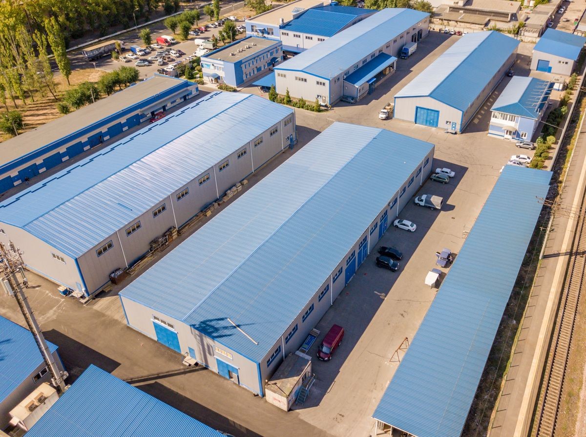 aerial top view of warehouses hangars near the industrial factory zone